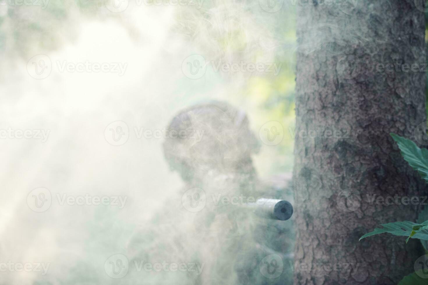 soldier in action aiming  on weapon  laser sight optics photo