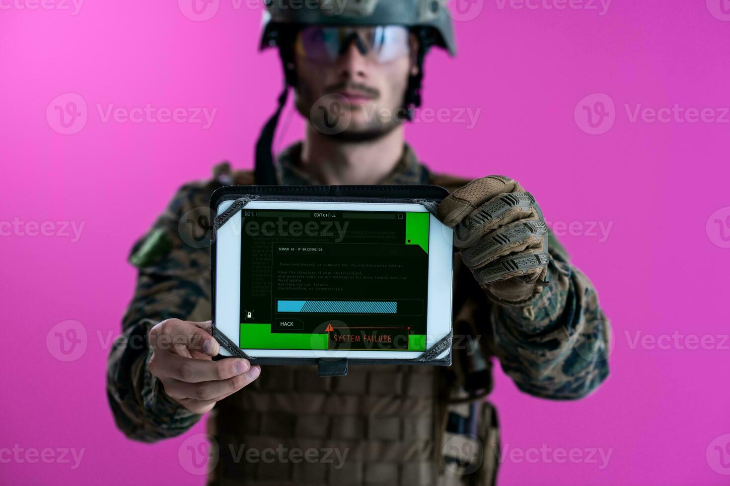 soldier showing a tablet with a blank green screen photo