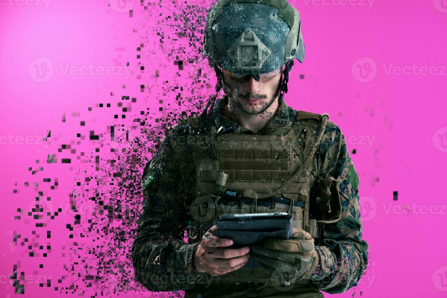 soldier using tablet computer closeup pixelated photo