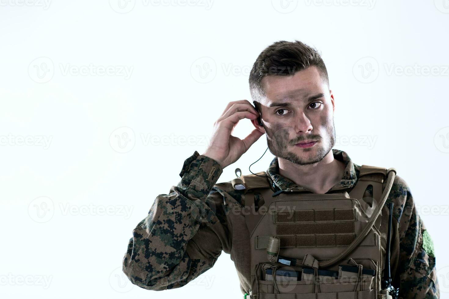 soldier preparing gear for action photo