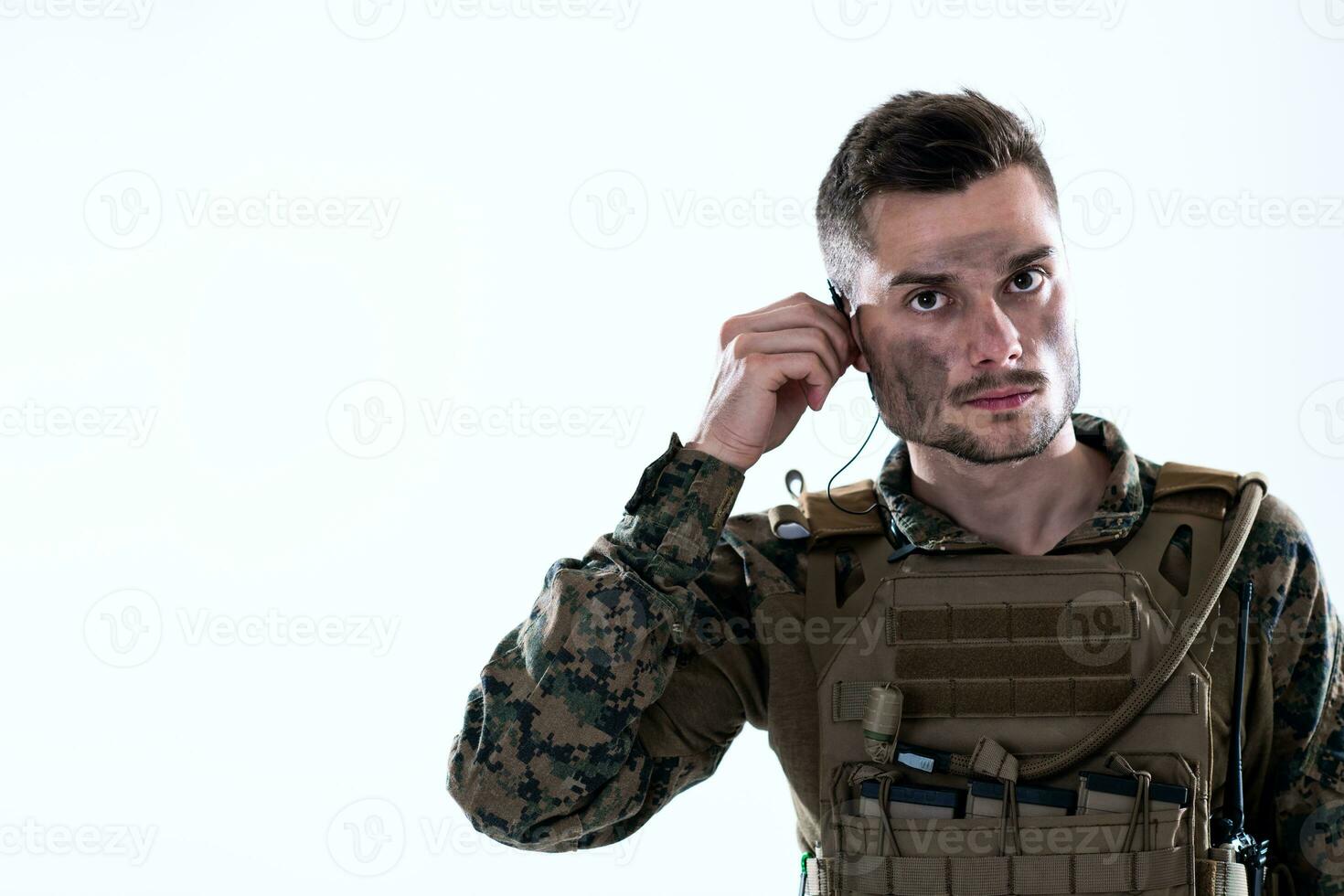 soldier preparing gear for action photo