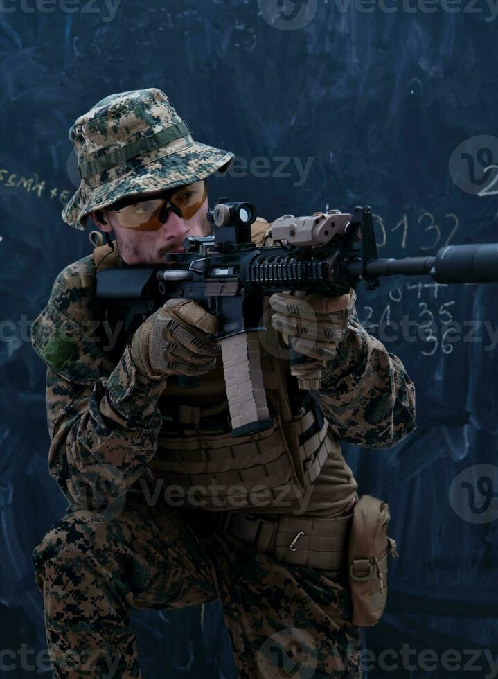 soldier in action aiming laseer sight optics photo