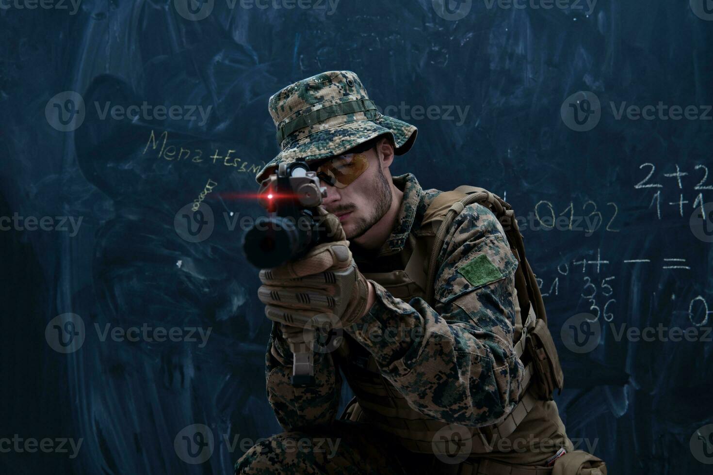 soldier in action aiming laseer sight optics photo