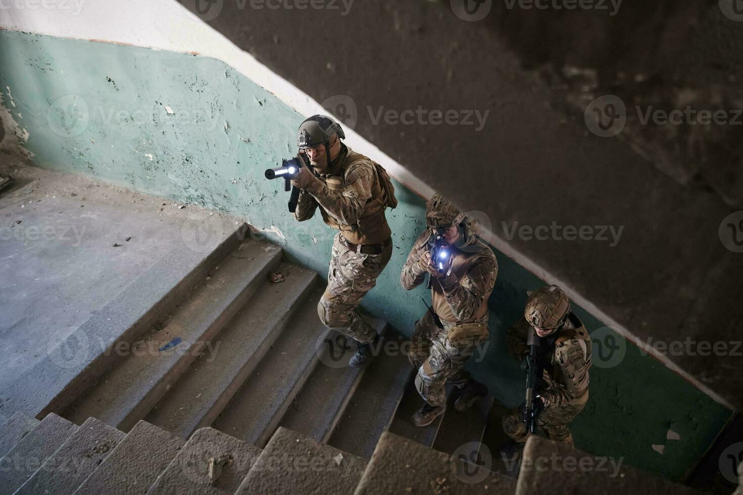 modern warfare soldiers ascent stairs in combat photo