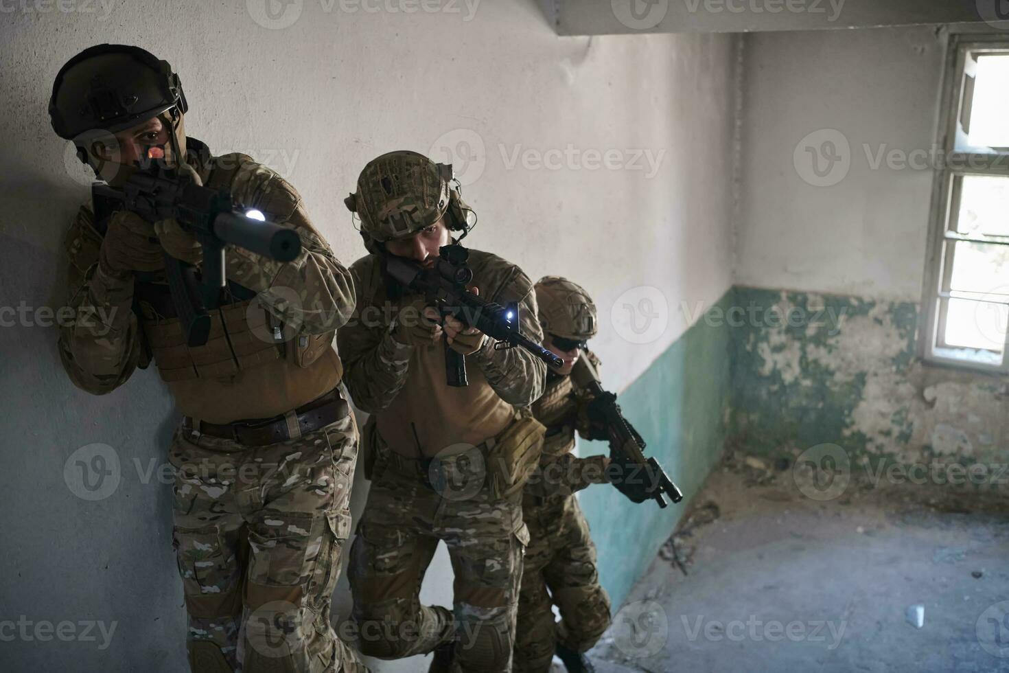 modern warfare soldiers ascent stairs in combat photo