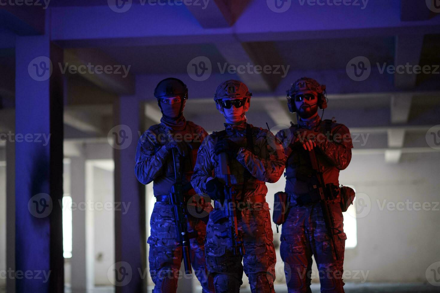 soldier squad team portrait in urban environment colored lightis photo