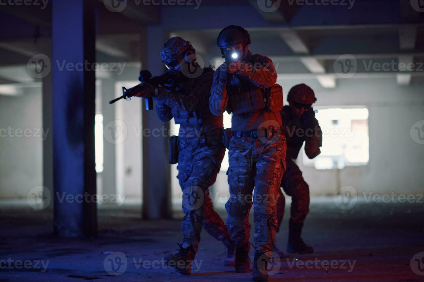 Soldiers squad  in tactical formation  having action urban environment photo