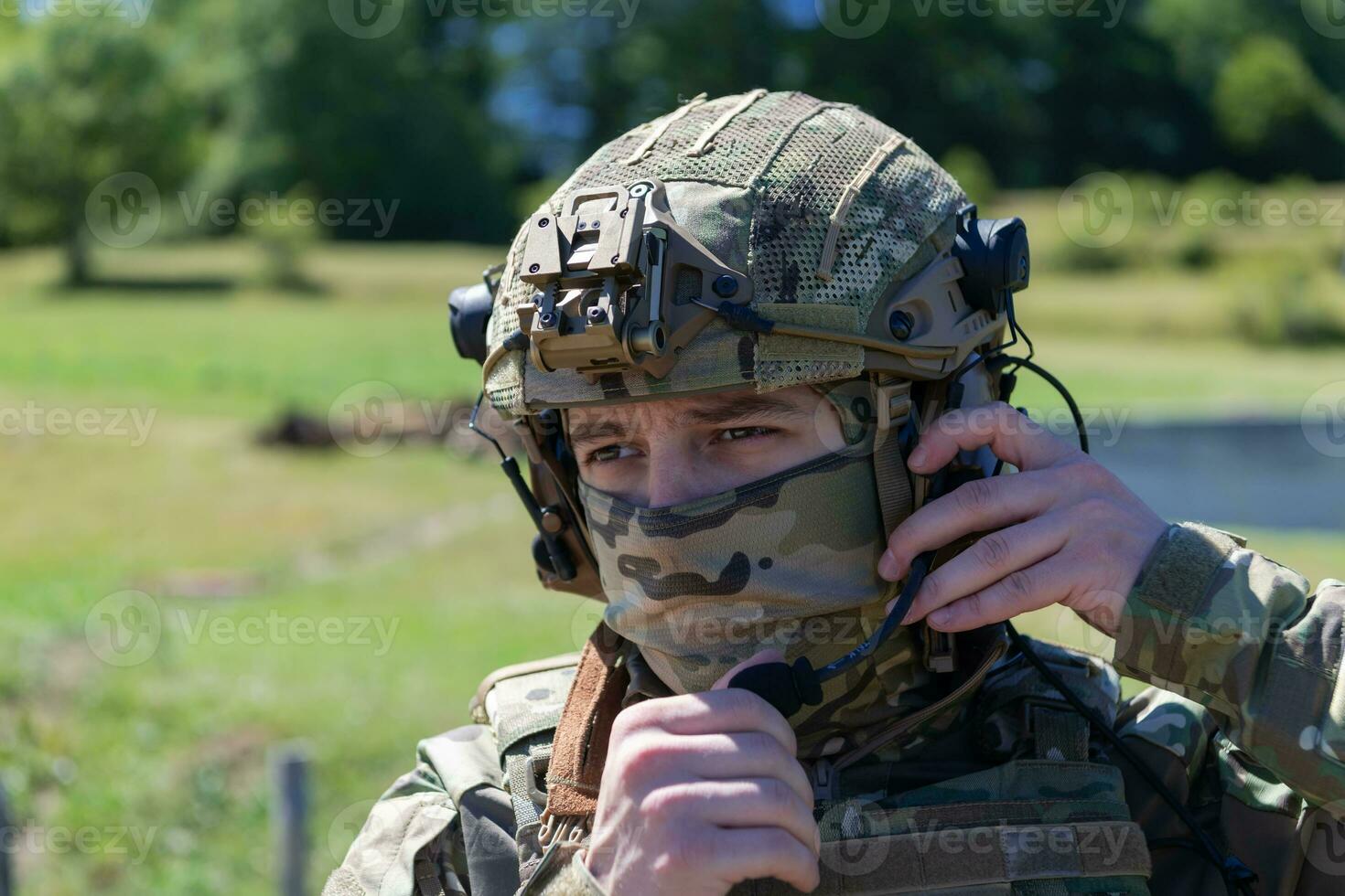 special operations soldiers team preparing tactical and communication gear for action battle. Long distance sniper team in checking gear for action photo