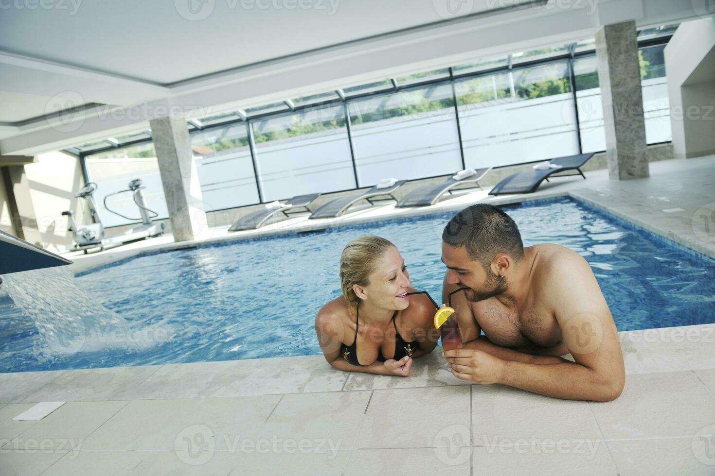 happy cople at swimming pool photo