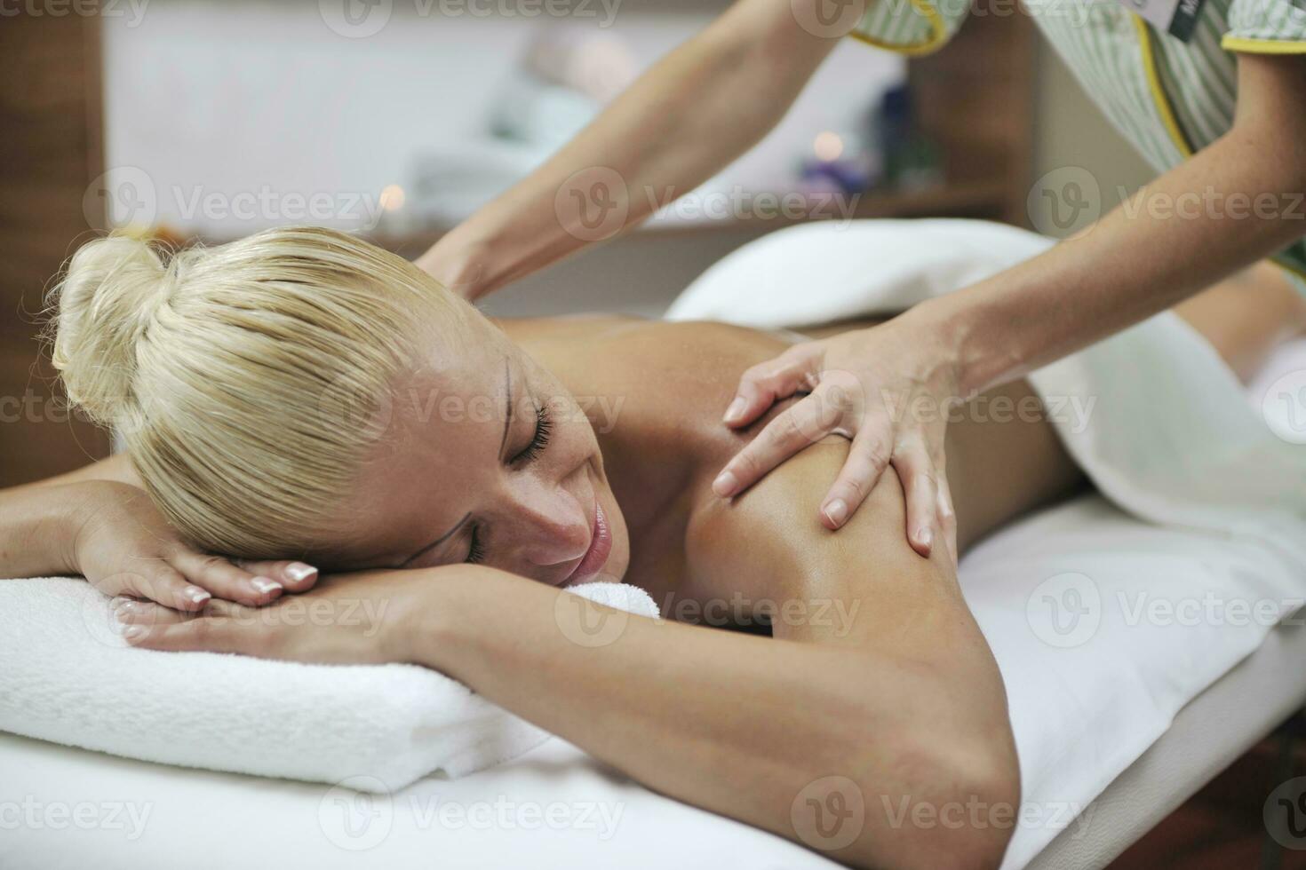 woman at spa and wellness back massage photo