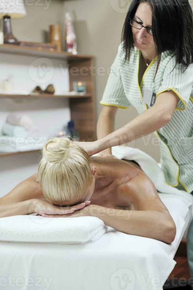 woman back massage treatment photo