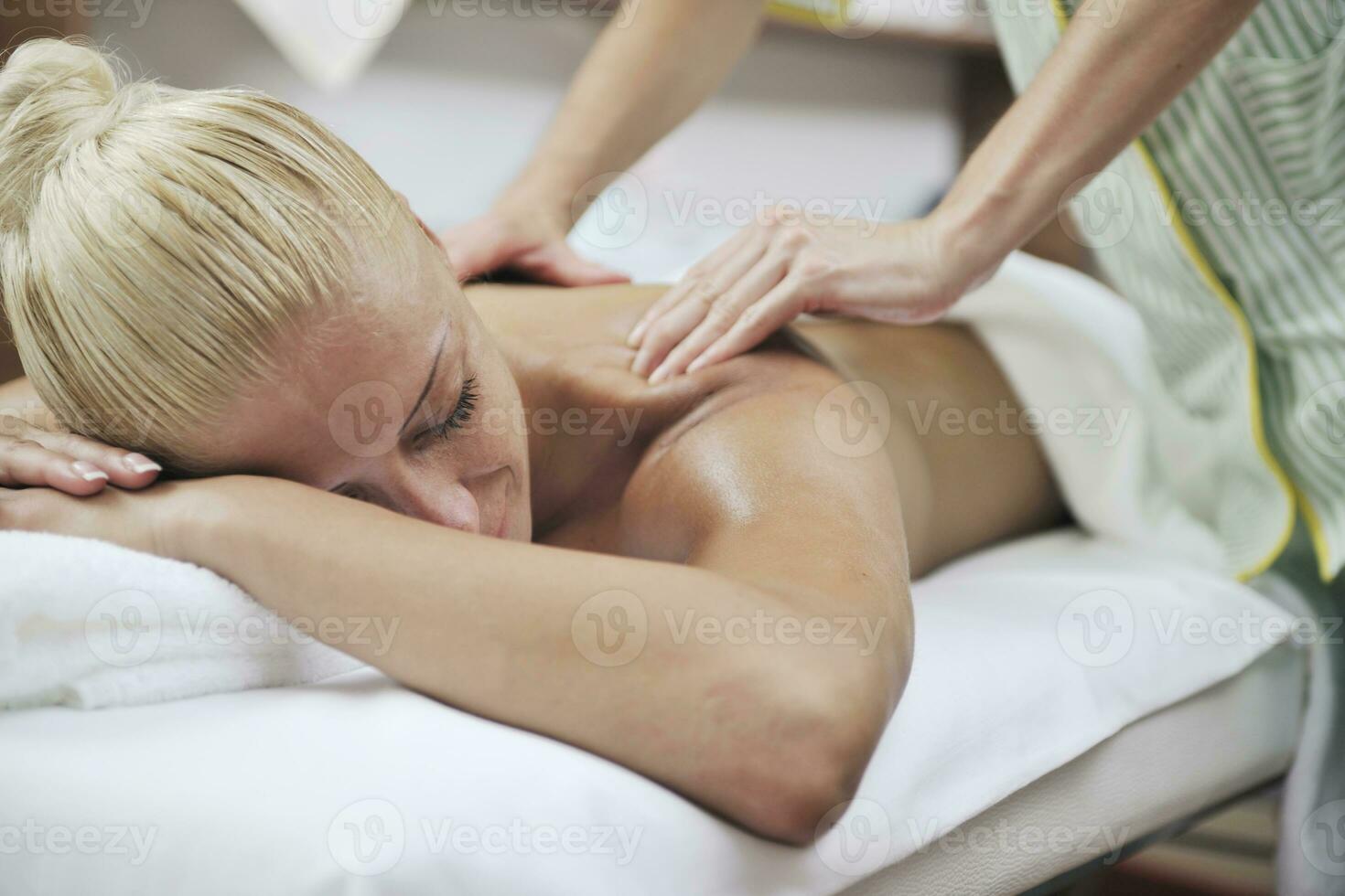 woman back massage treatment photo