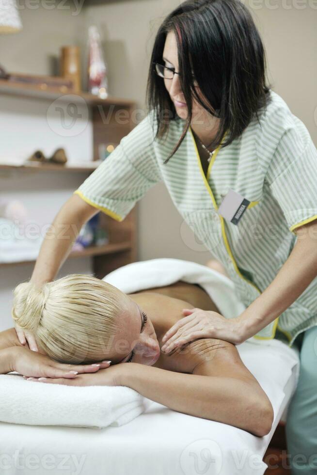 woman back massage treatment photo