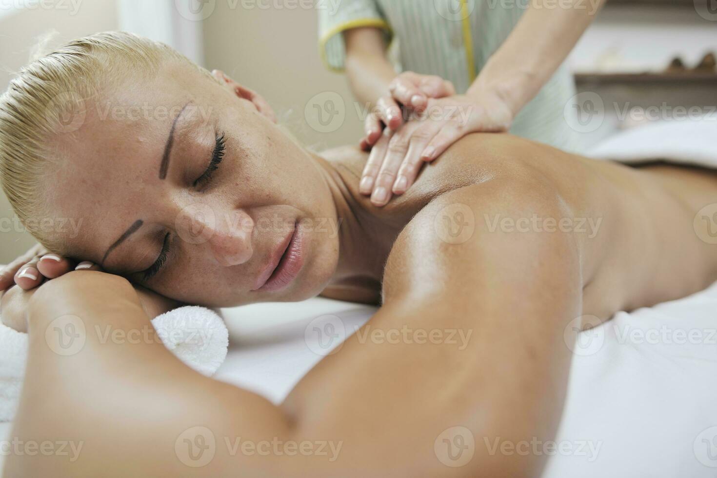 woman back massage treatment photo