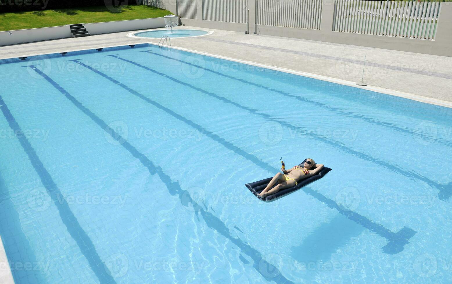 beautiful woman relax on swimming pool photo