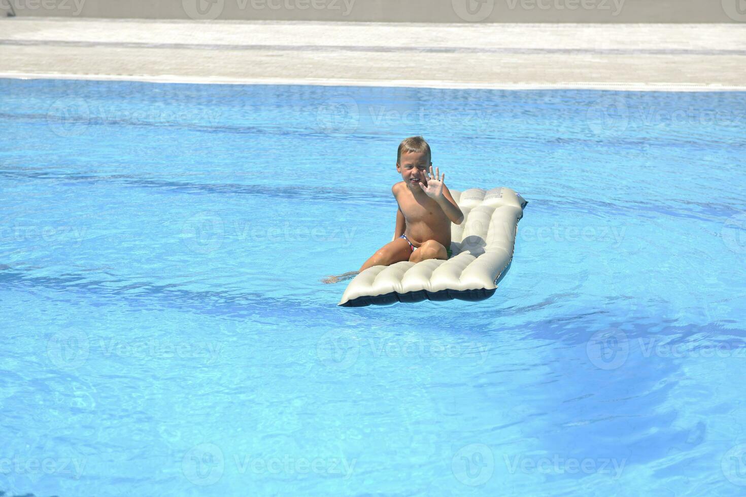 children on swimming pool photo