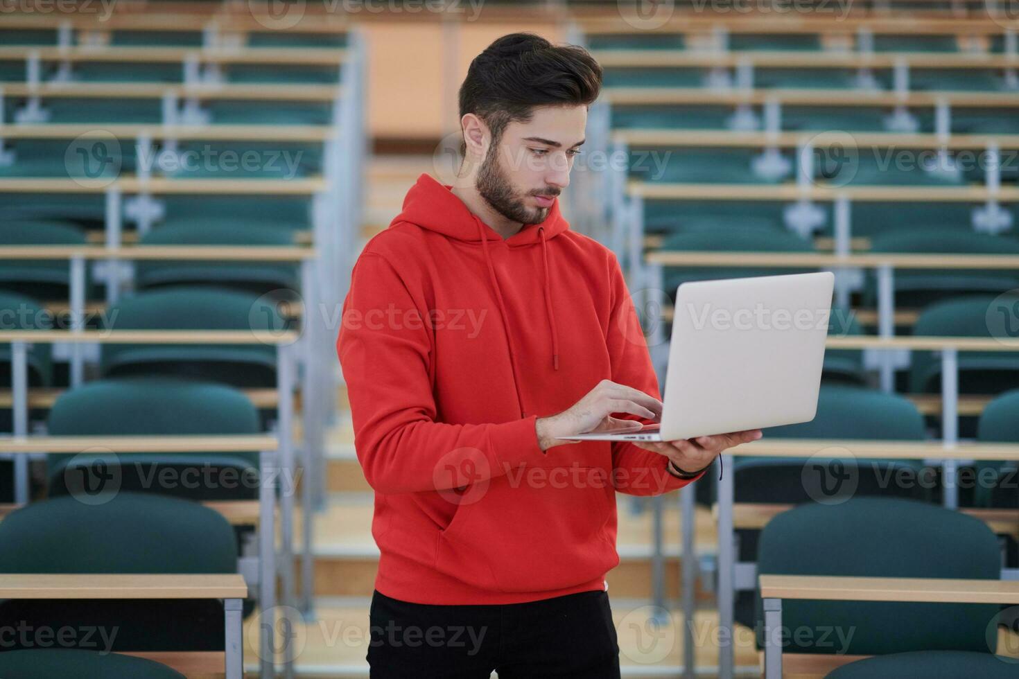 the student uses a notebook in school photo