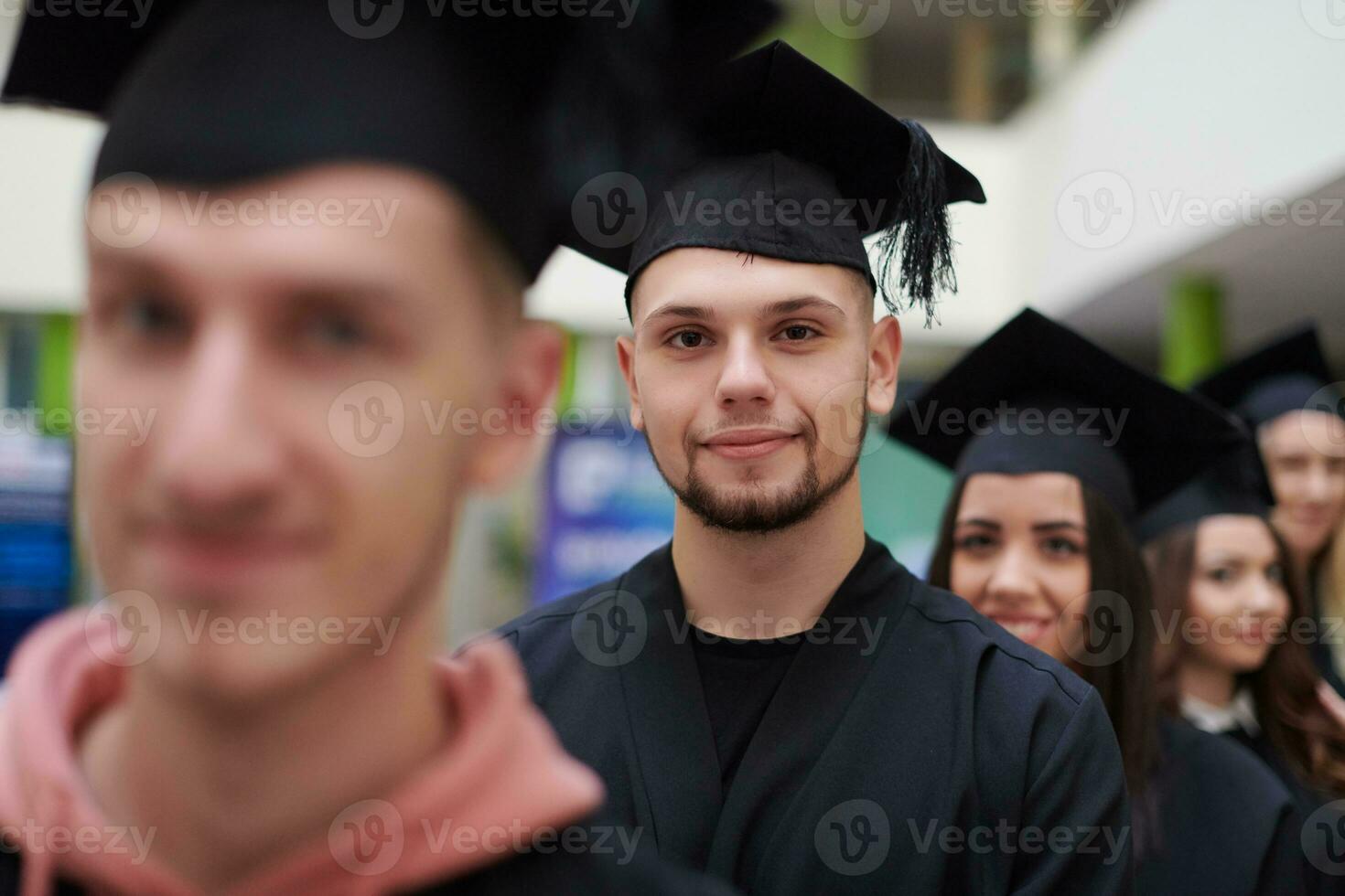 Group of diverse international graduating students celebrating photo