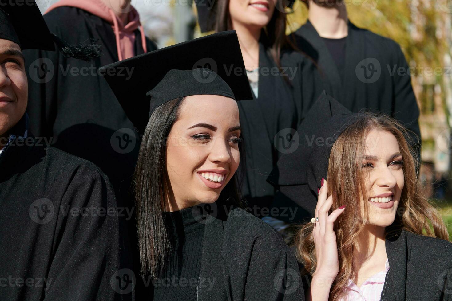 Group of diverse international graduating students celebrating photo