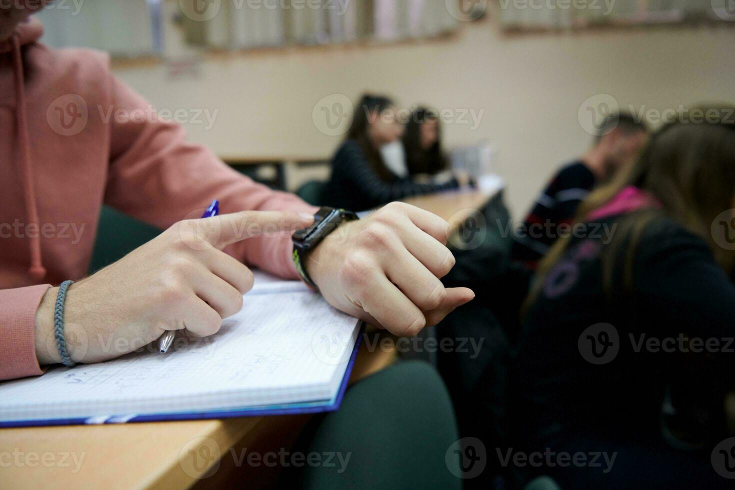 the student uses a smartwatch in math class photo