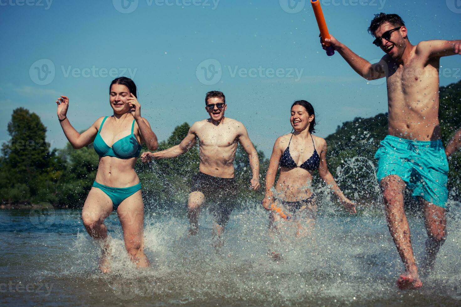 summer joy friends having fun on river photo