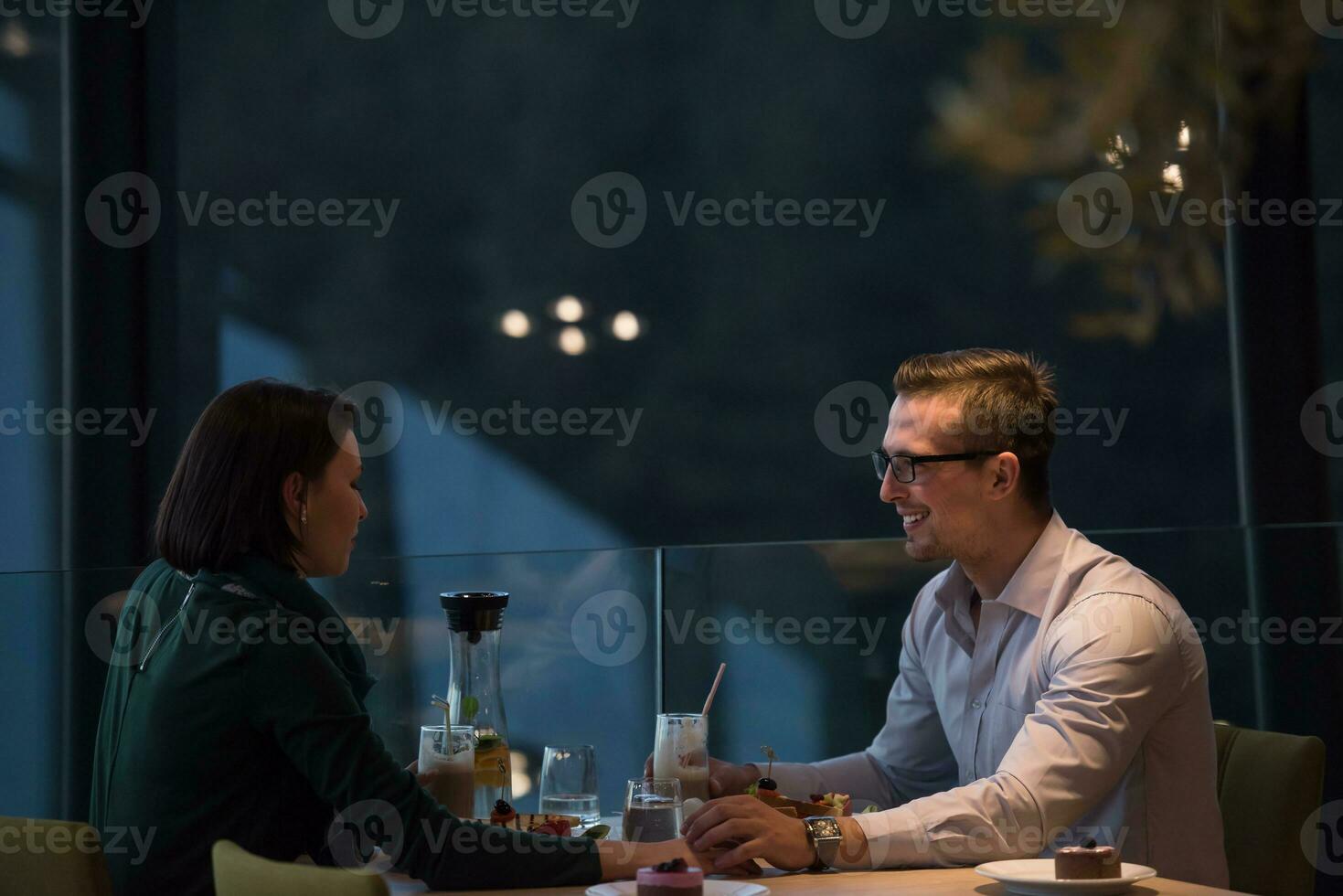 Couple on a romantic dinner at the restaurant photo