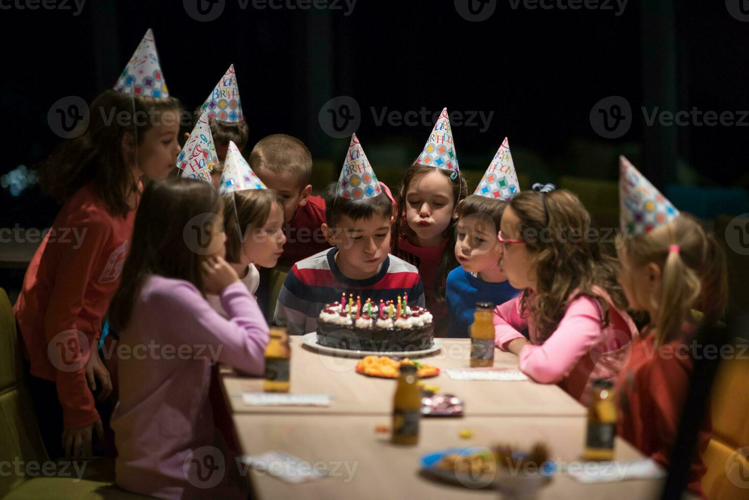 The young boy joyfully celebrating his birthday photo