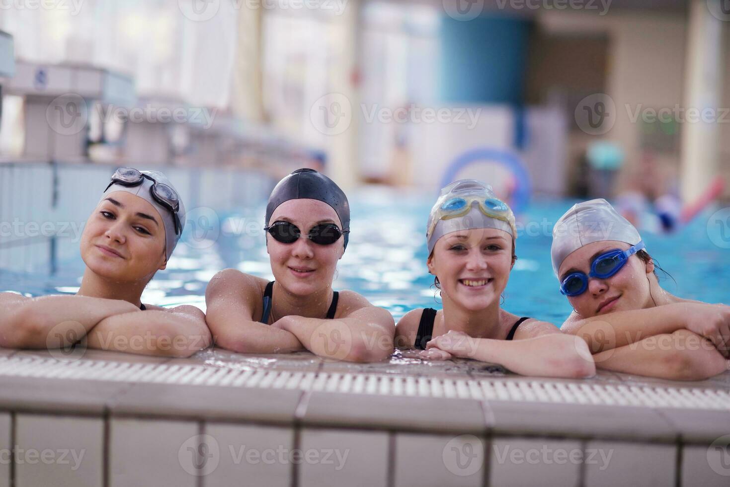 happy teen group  at swimming pool photo