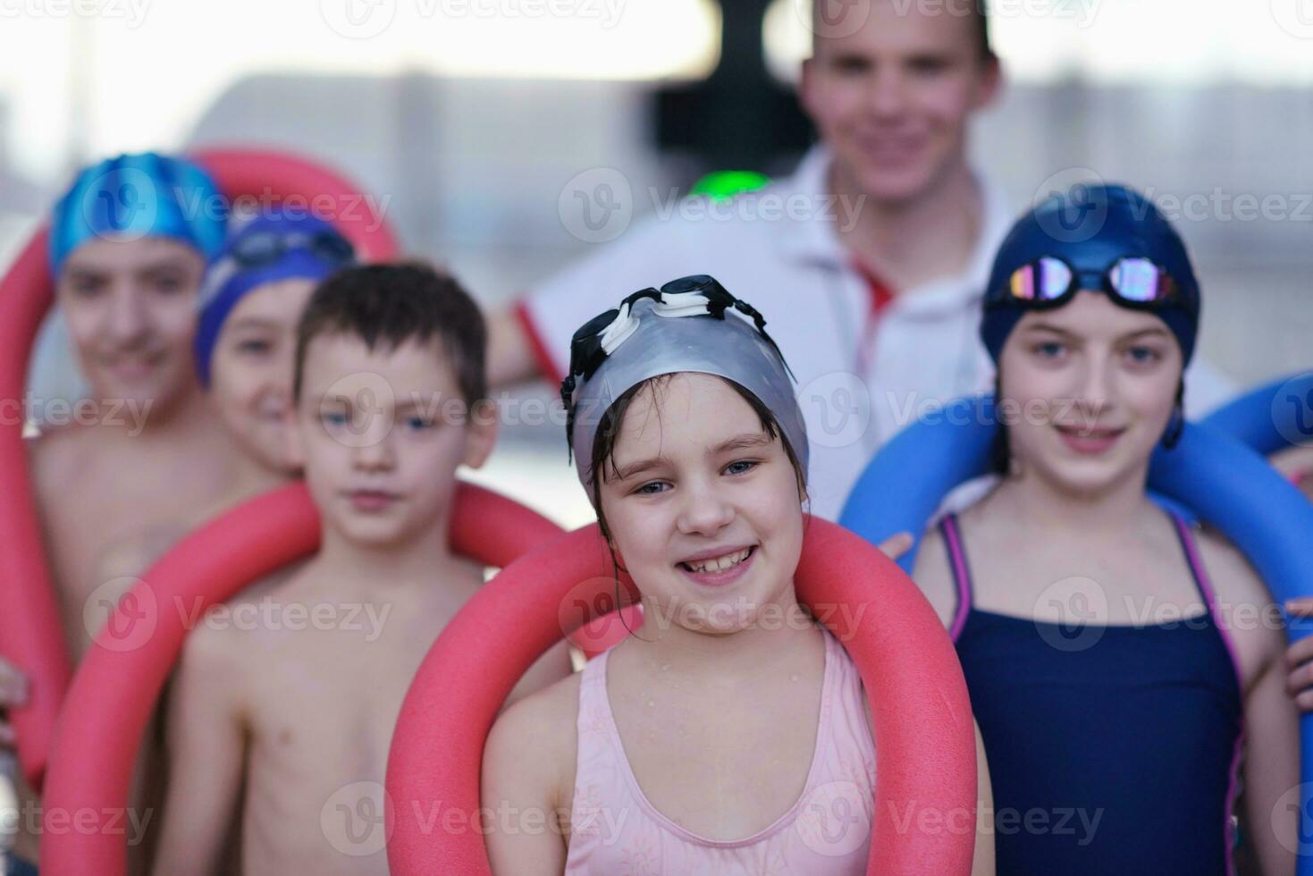 happy children group  at swimming pool photo