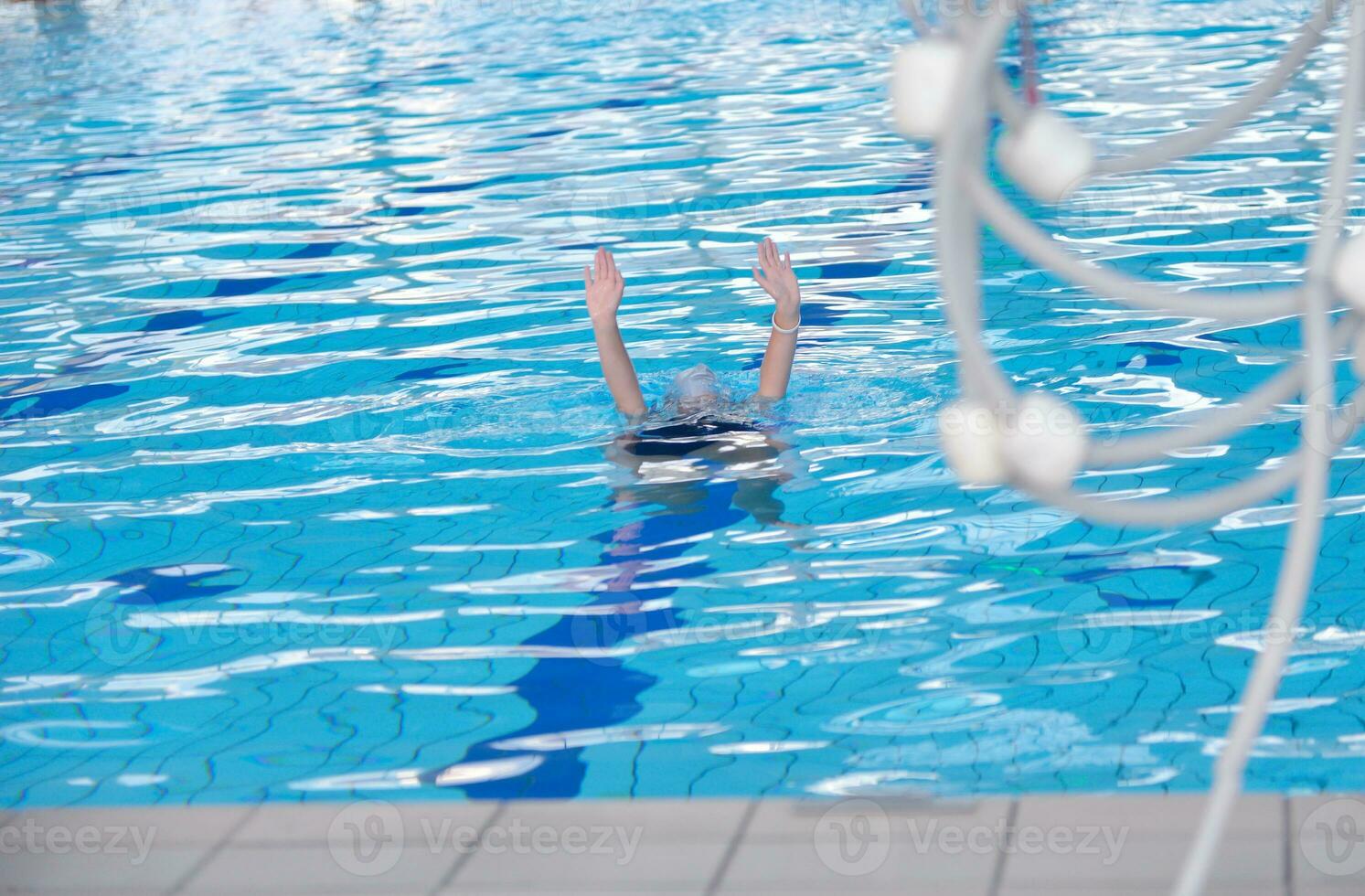 help and rescue on swimming pool photo