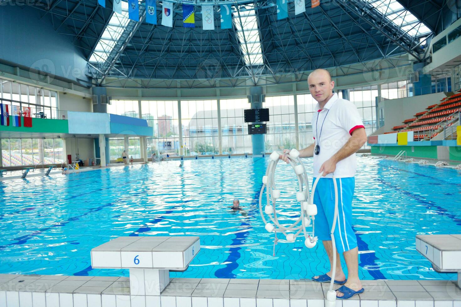help and rescue on swimming pool photo