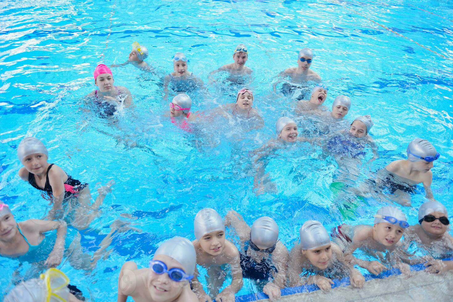 children group  at swimming pool photo