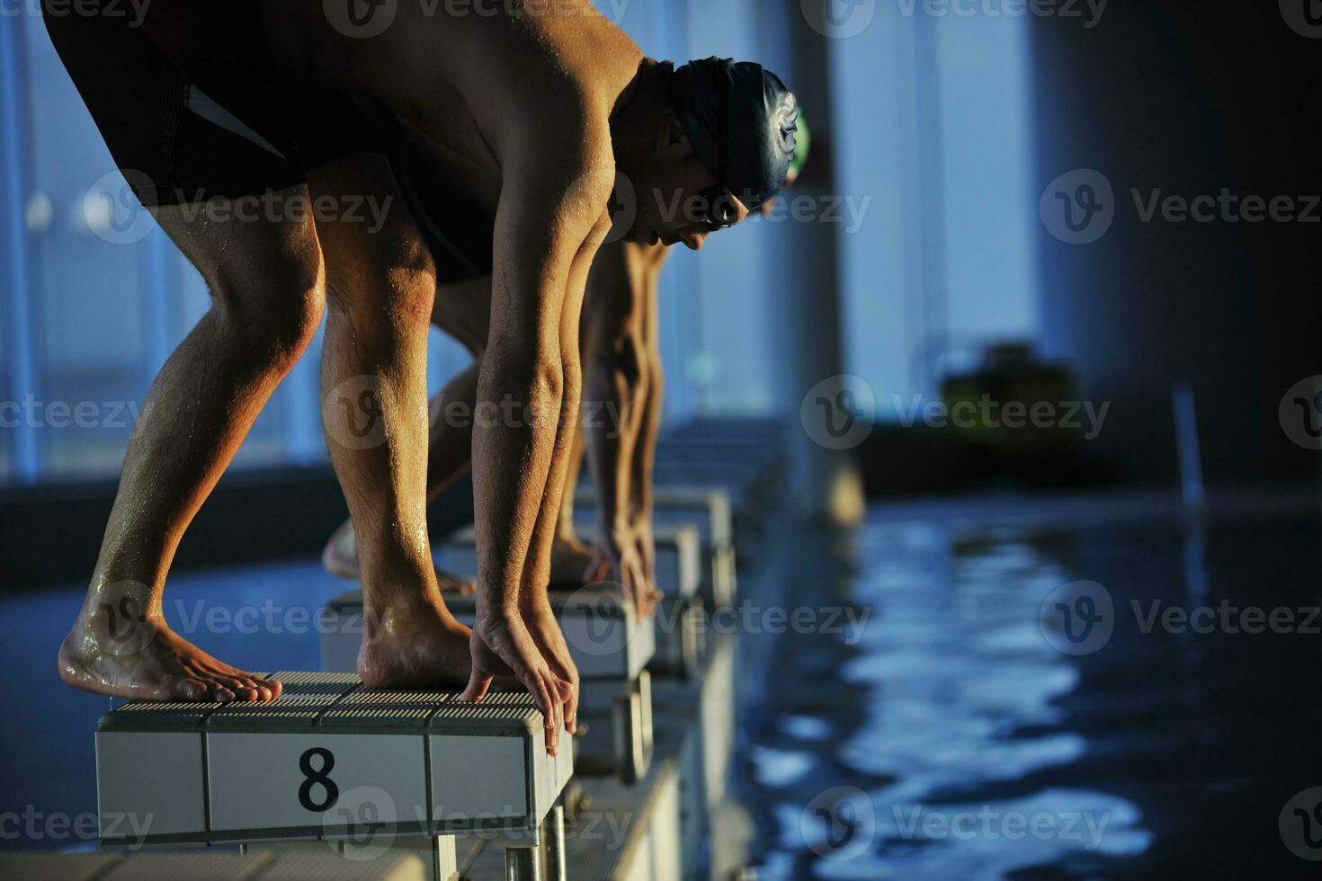 young swimmmer on swimming start photo