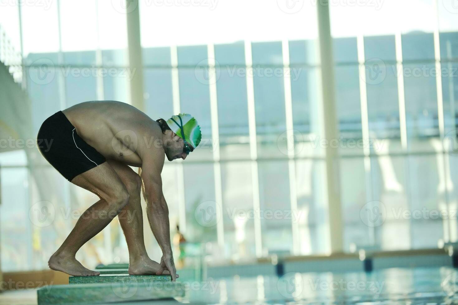 young swimmmer on swimming start photo