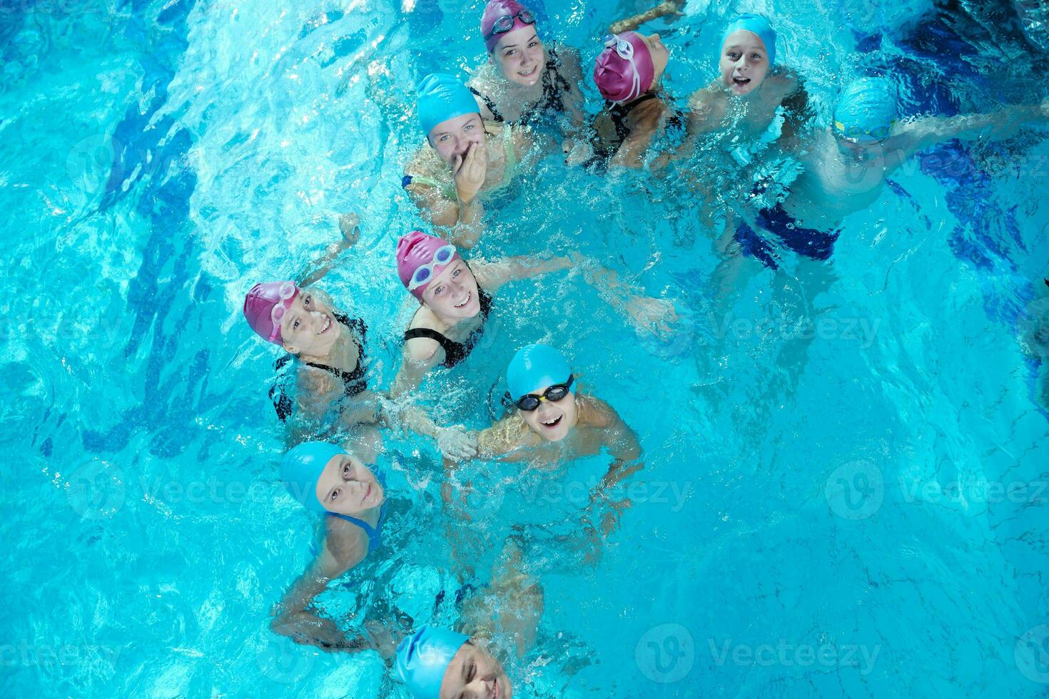 happy childrens at swimming pool photo