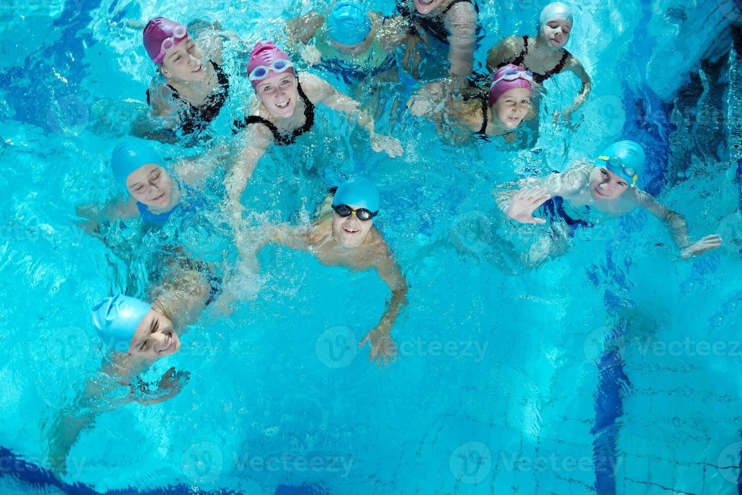 happy childrens at swimming pool photo