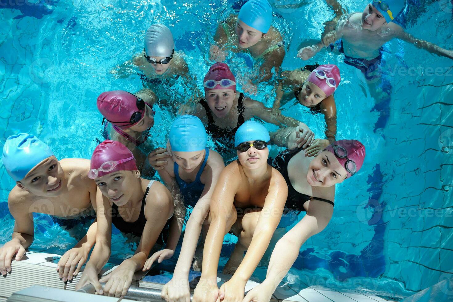 happy children group  at swimming pool photo