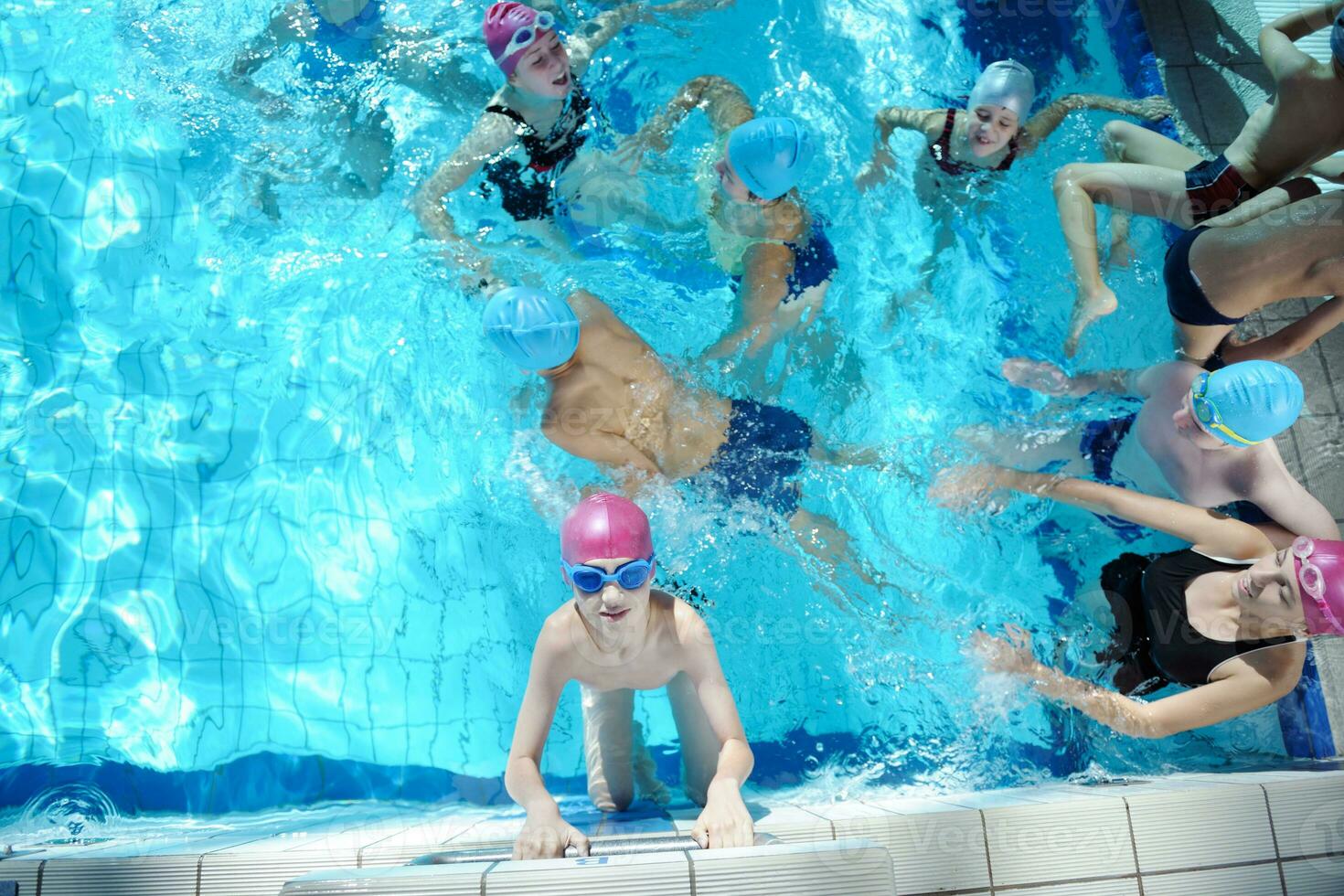 happy children group  at swimming pool photo