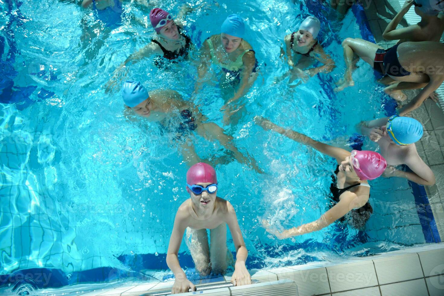 happy childrens at swimming pool photo