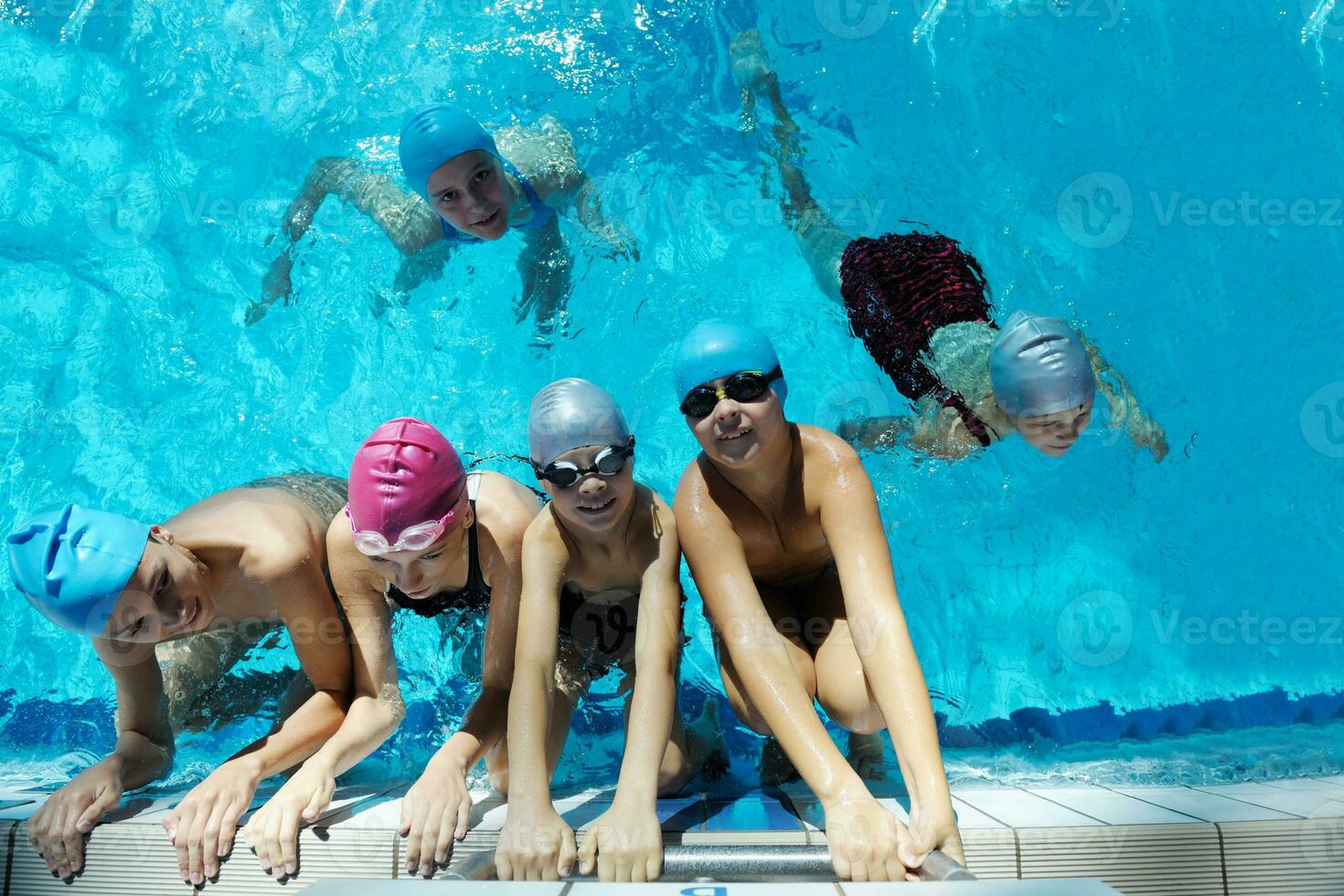 happy children group  at swimming pool photo
