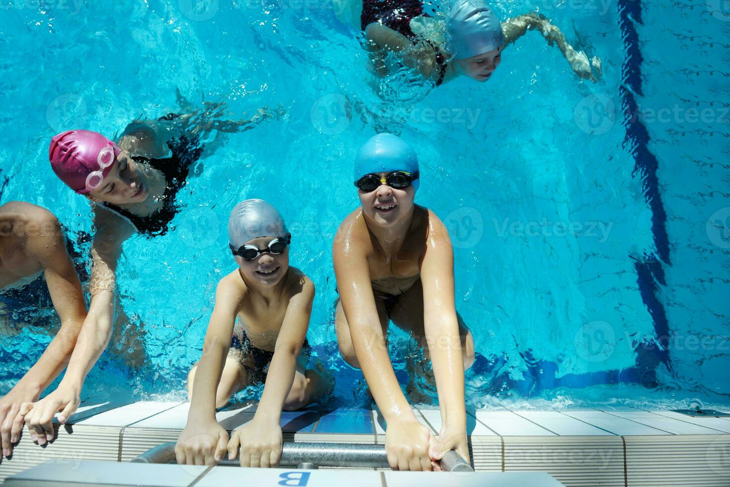 happy children group  at swimming pool photo