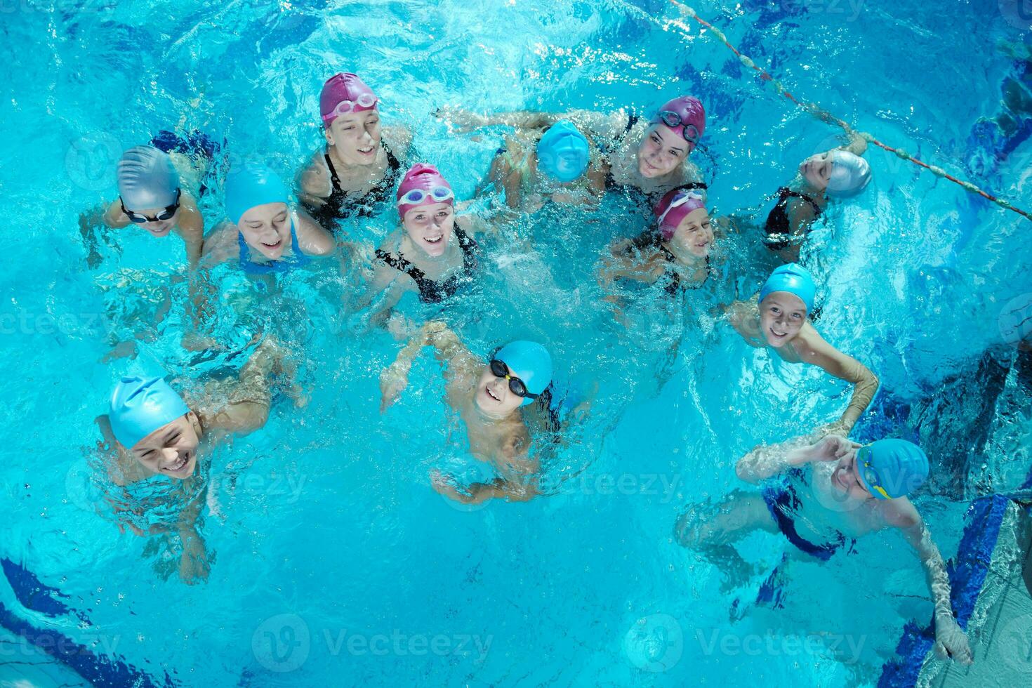 happy childrens at swimming pool photo