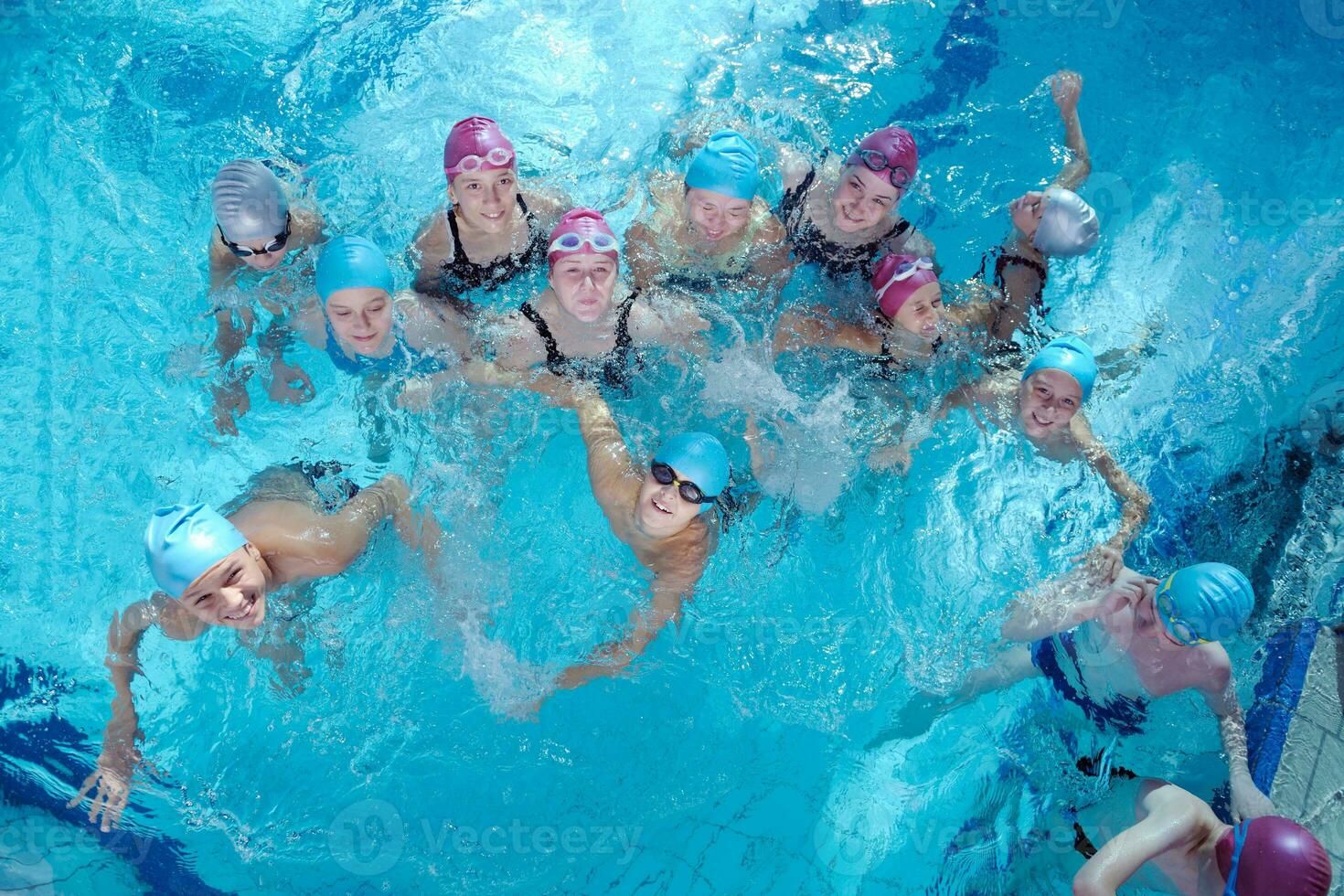 happy children group  at swimming pool photo