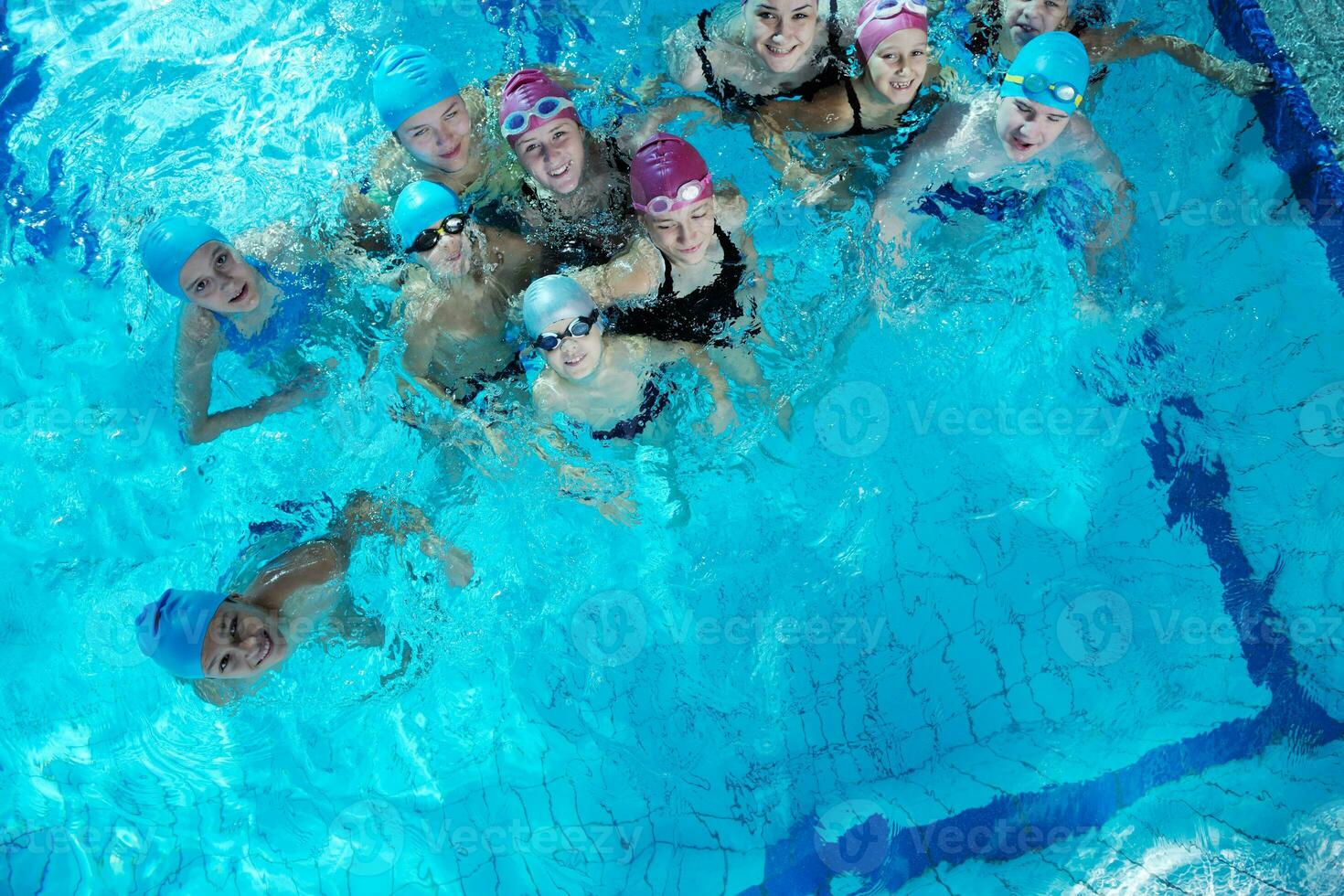 happy childrens at swimming pool photo