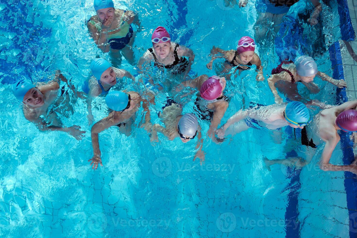 happy children group  at swimming pool photo