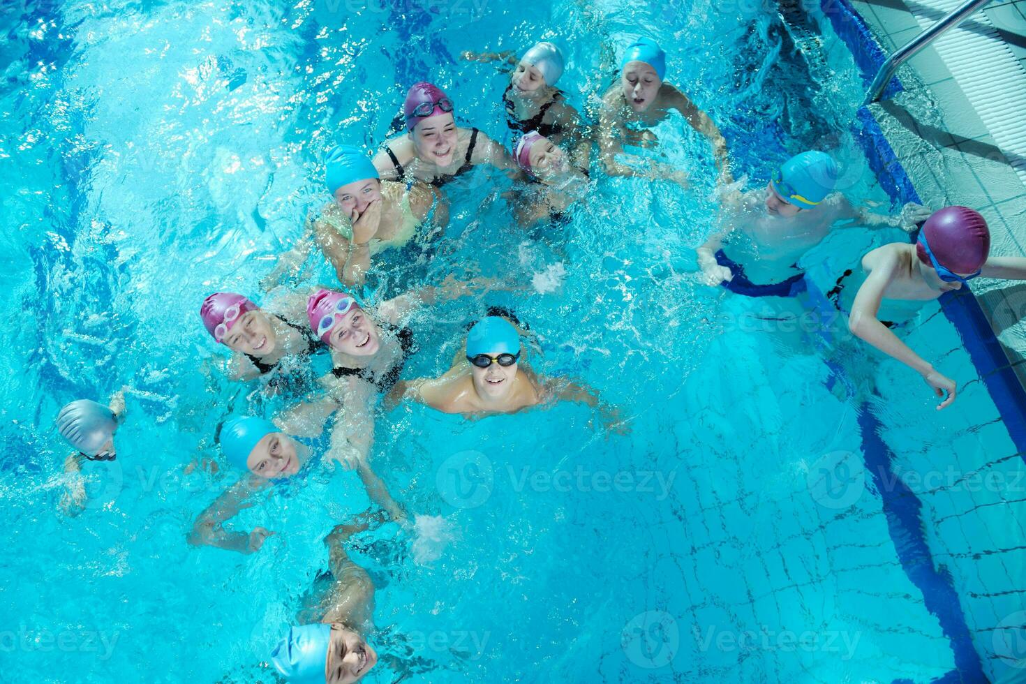 happy childrens at swimming pool photo