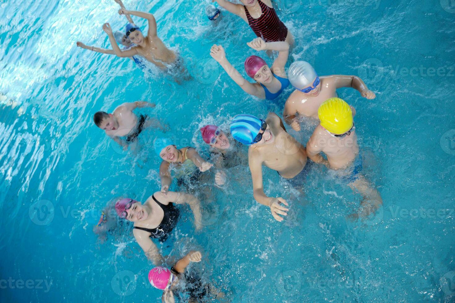 happy children group  at swimming pool photo