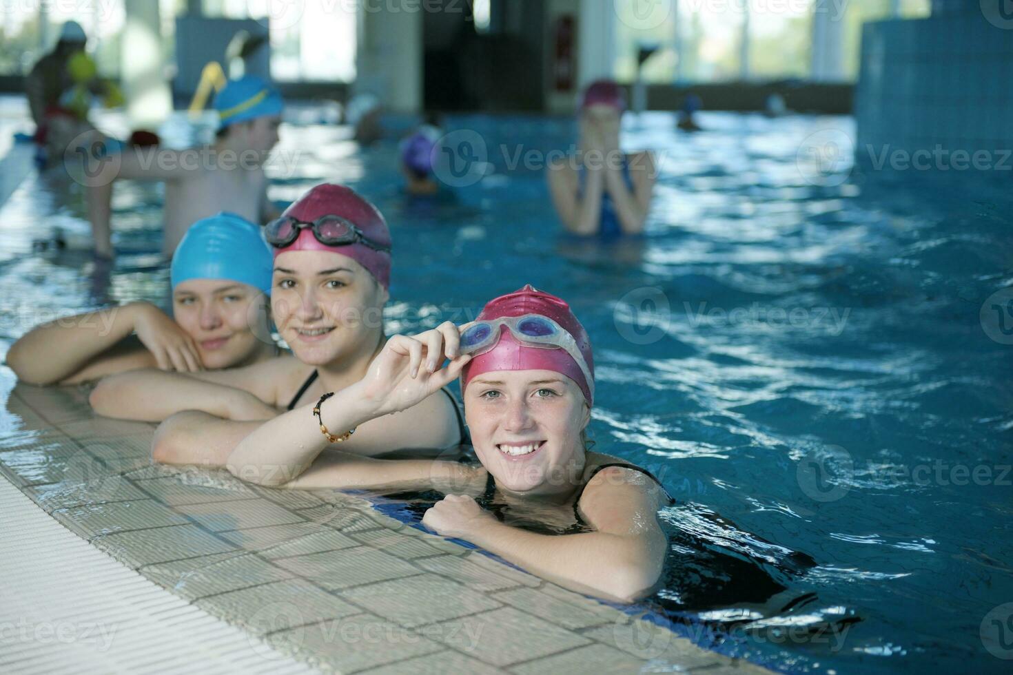 happy childrens at swimming pool photo