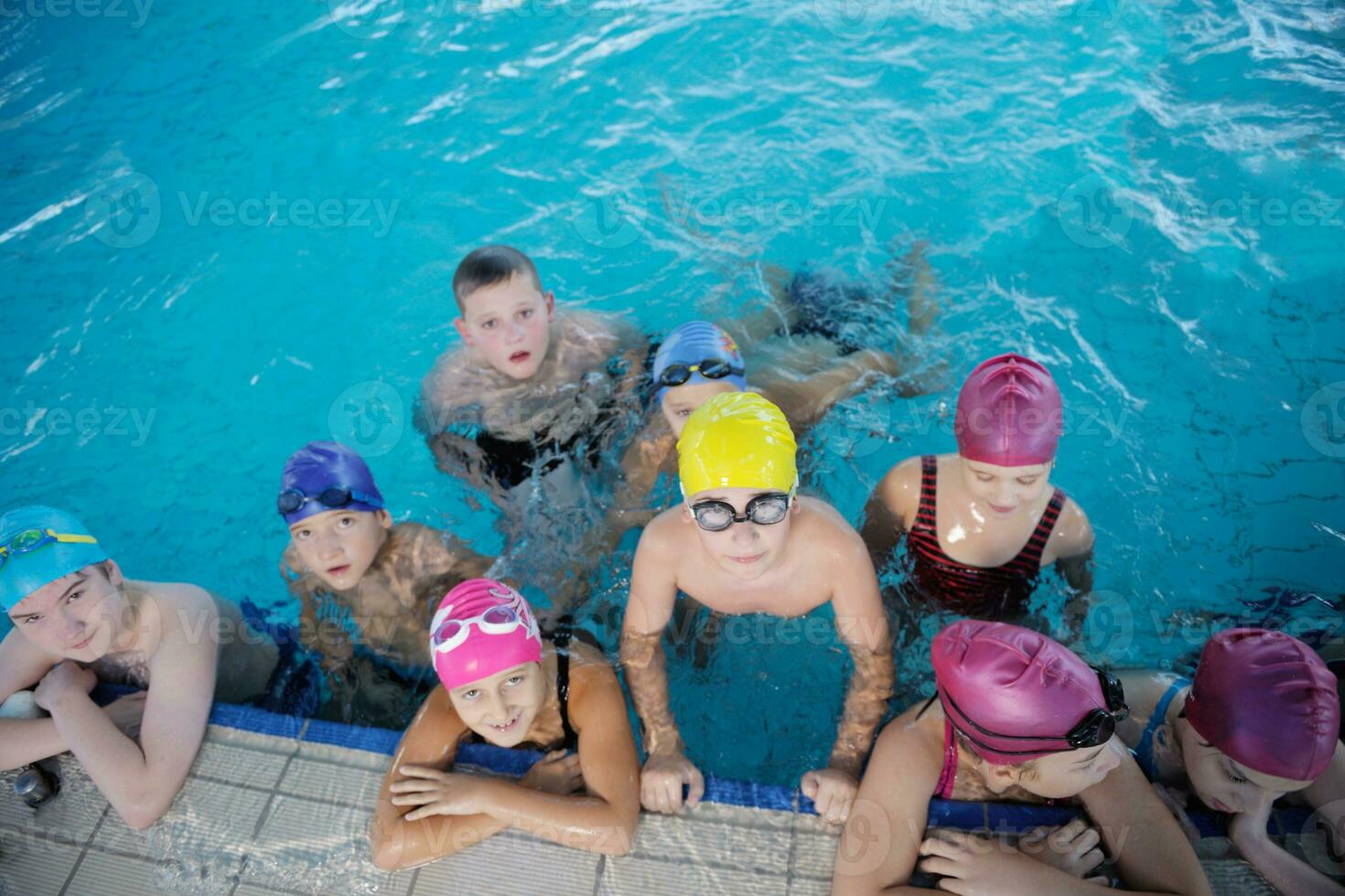 happy children group  at swimming pool photo