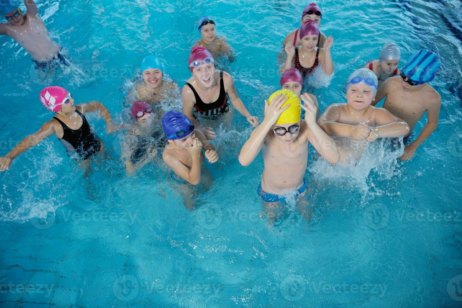 happy children group  at swimming pool photo